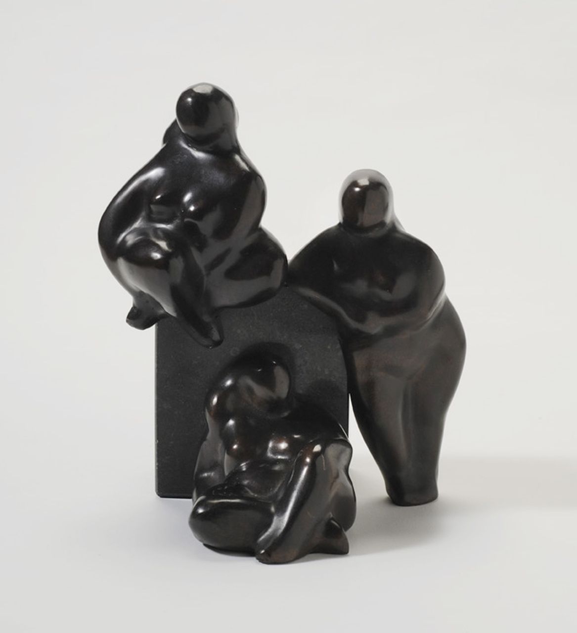 Theo Germann | Three women, bronze, 21.7 x 18.8 cm, signed at the back of the standing figure and dated '87 on the reverse