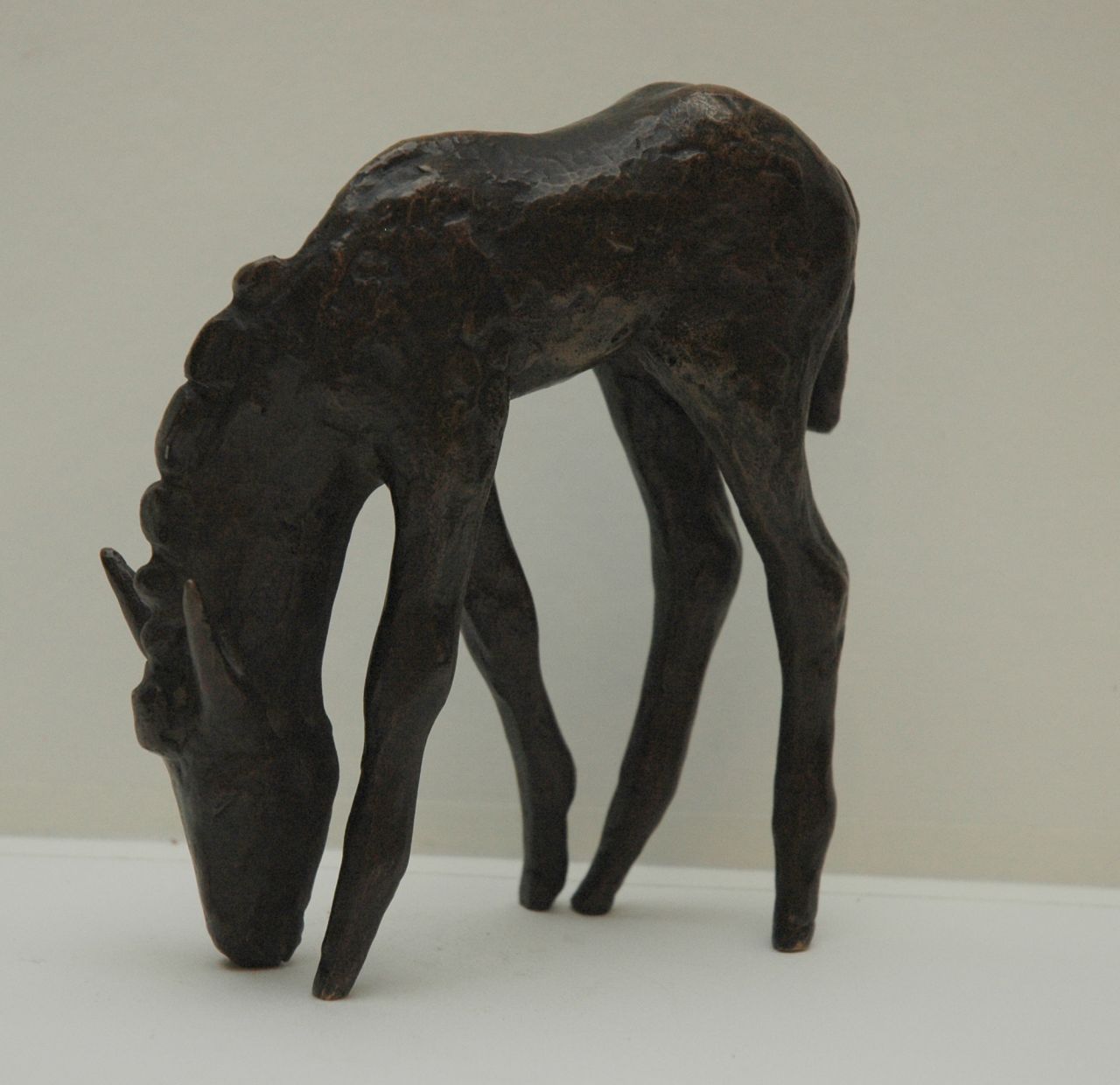 Baisch E.  | Ernst Baisch, Donkey foal, patinated bronze 14.0 x 10.0 cm, signed with initials on nose