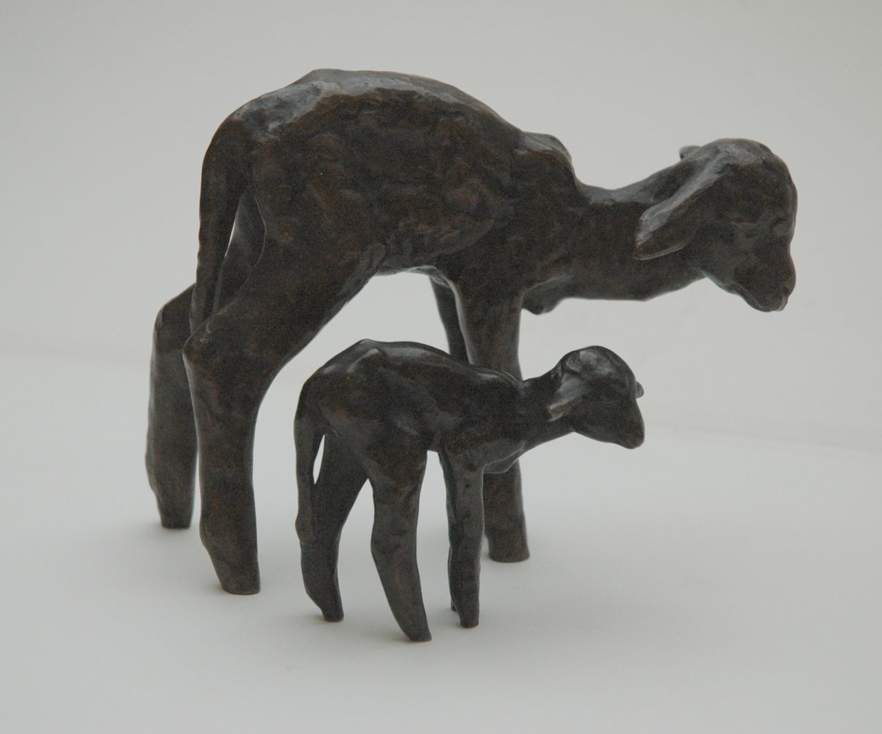 Baisch E.  | Ernst Baisch, Two lambs, patinated bronze 12.0 x 15.0 cm, signed with initials beneath the frontlegs