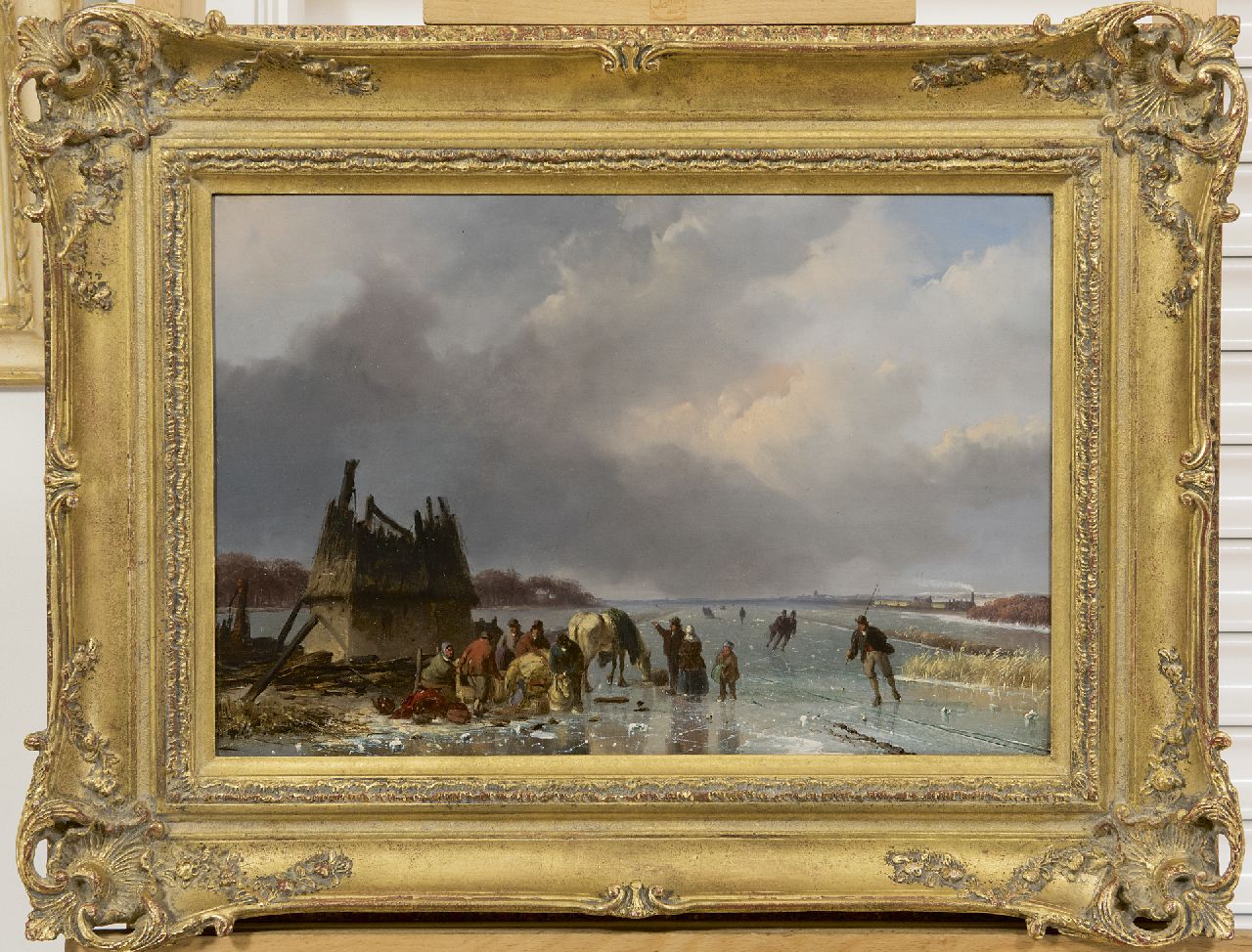 Roosenboom N.J.  | Nicolaas Johannes Roosenboom, A frozen river with skaters and a horse-drawn sledge, oil on panel 29.4 x 43.7 cm, signed l.r. and painted ca. 1850-1855