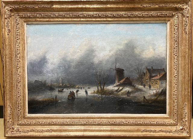 Jacob Jan Coenraad Spohler | Skaters and sleds on the ice in an upcoming snowstorm, oil on canvas, 43.8 x 67.2 cm, signed l.r.