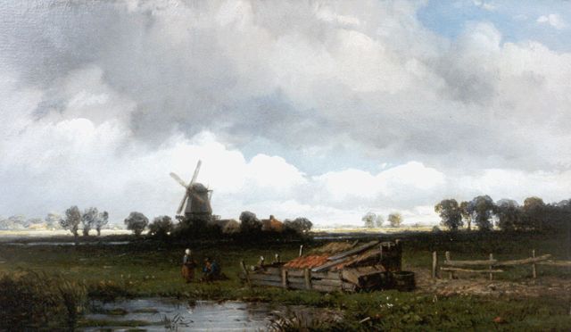 Wijngaerdt A.J. van | An extensive landscape, a windmill beyond, oil on panel 15.5 x 26.4 cm, signed l.r.